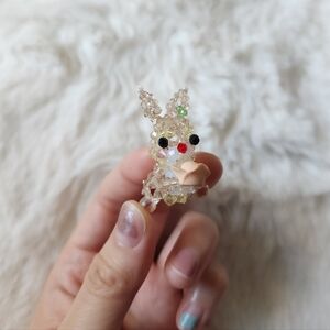 Handmade beaded cream bunny holding flower I made